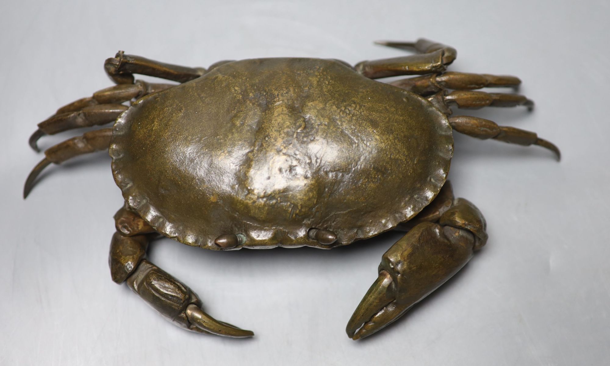 A mid 20th century bronze articulated model of a crab, with hinged carapace, 26cm across